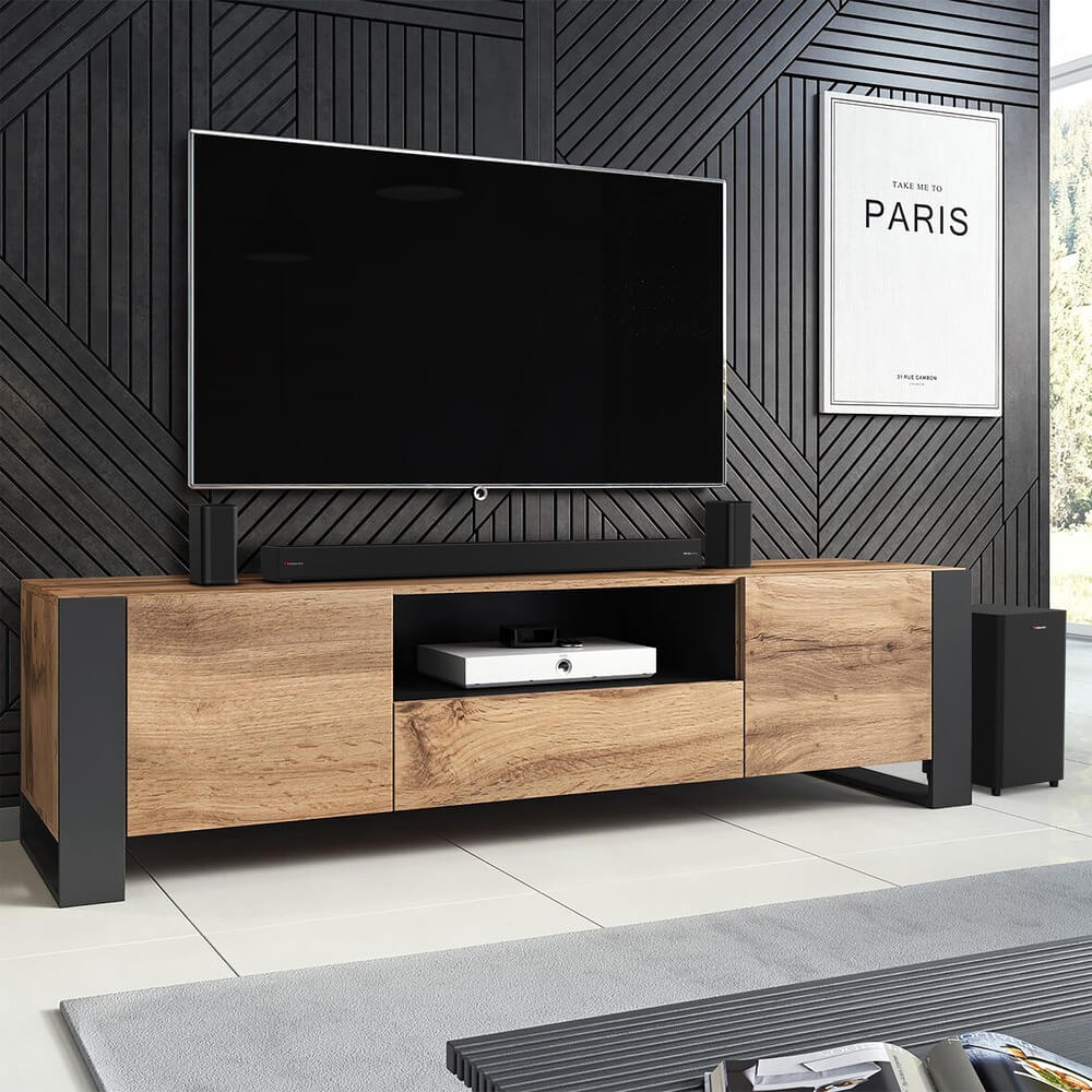 Nakamichi ARES 550 саундбар под телевизором на стене в интерьере гостиной