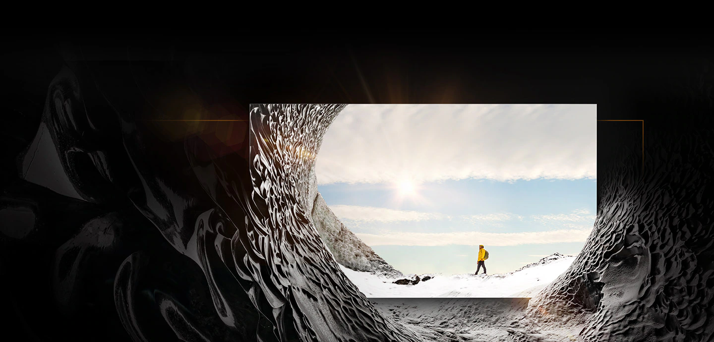MICRO LED is placed inside a mountain cave and is displaying the image of a mountain climber in the sun. The mountain cave blends into the on-screen image to show that the textures of inside and outside the mountain cave are indistinguishable from each other.