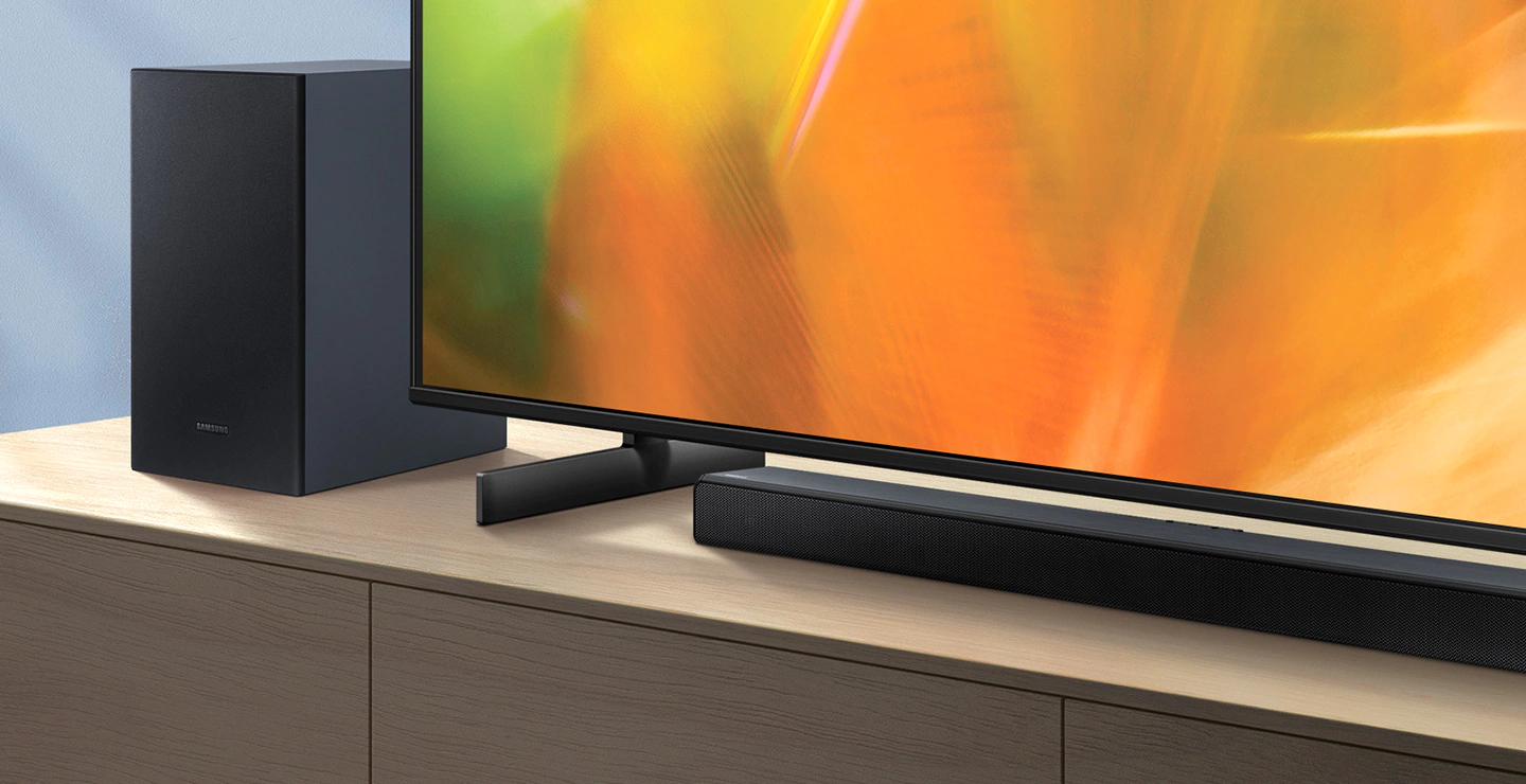 A45C Soundbar and subwoofer are positioned next to Crystal UHD TV.