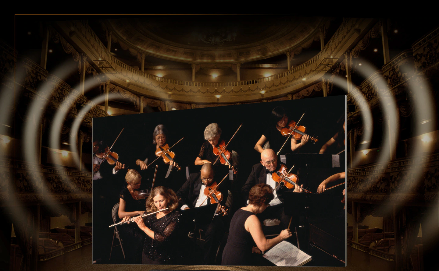 Soundbar-paired MICRO LED is showing a closeup of an orchestra performance. Large wave ripple graphics are projected from the TVs top corners and from the soundbar.